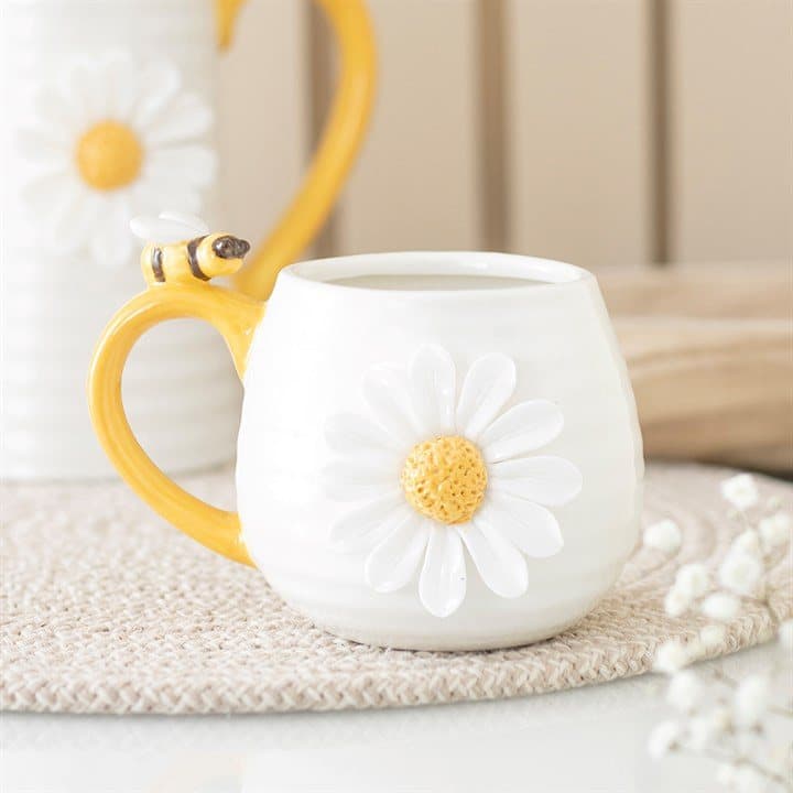 Ceramic mug with raised daisies and bees