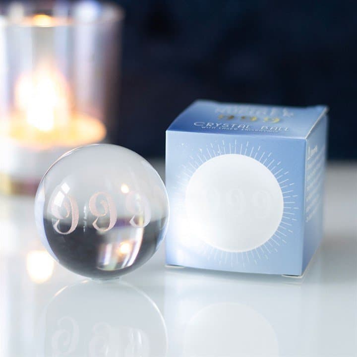 Glass crystal ball with the number 999 laser engraved inside