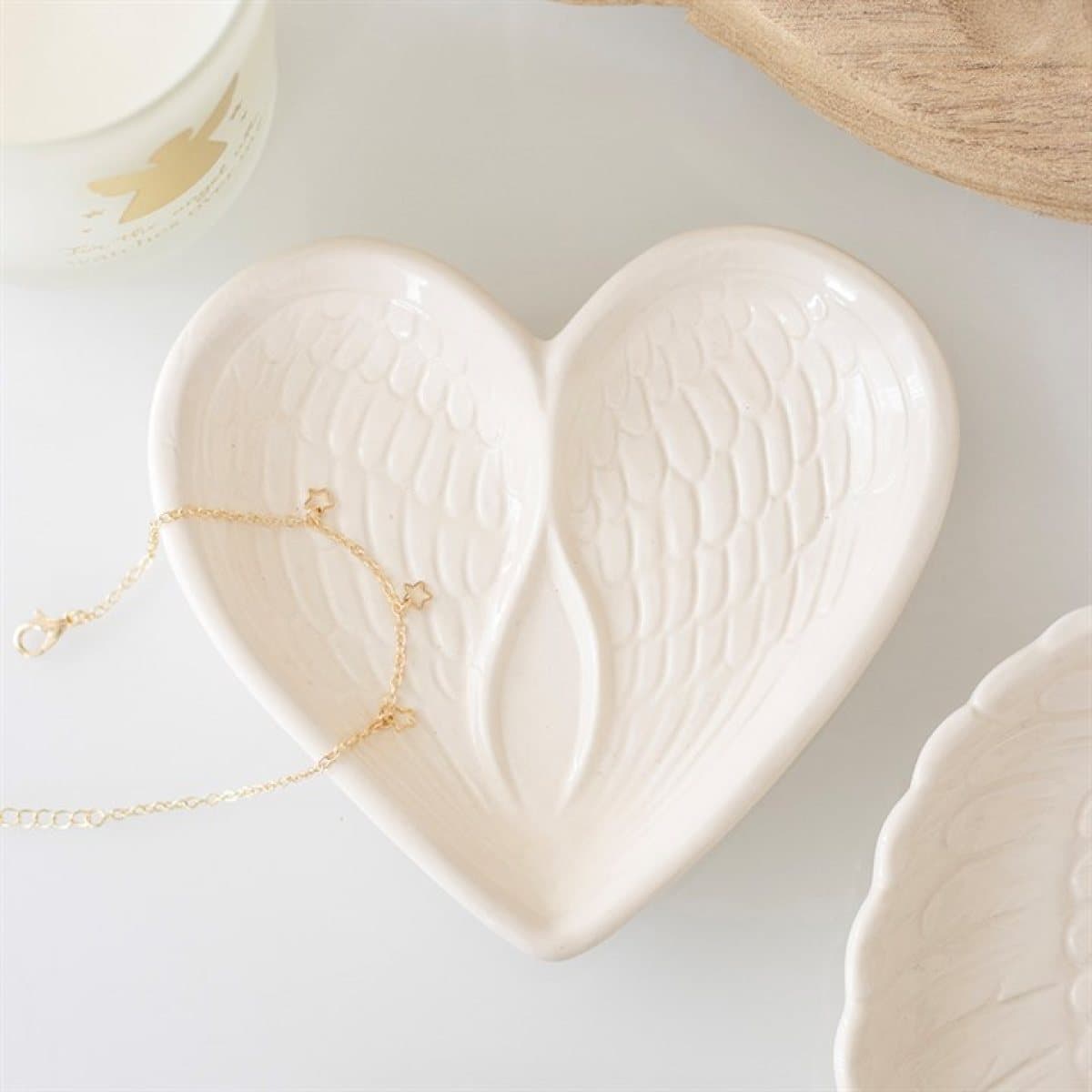 Heart-shaped off-white dish with two angel wings