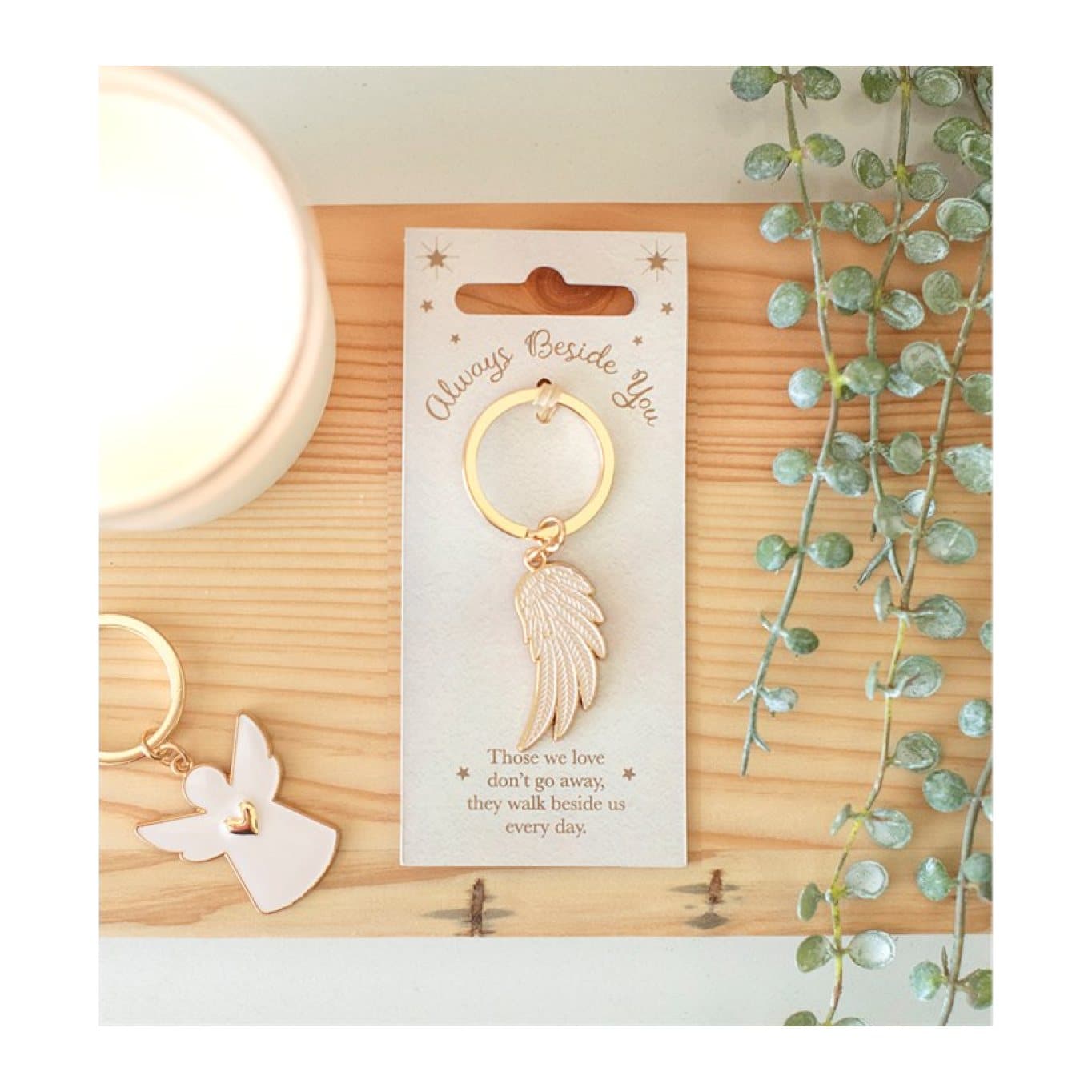 Metallic gold angel wing keyring on an Always Beside You backing card