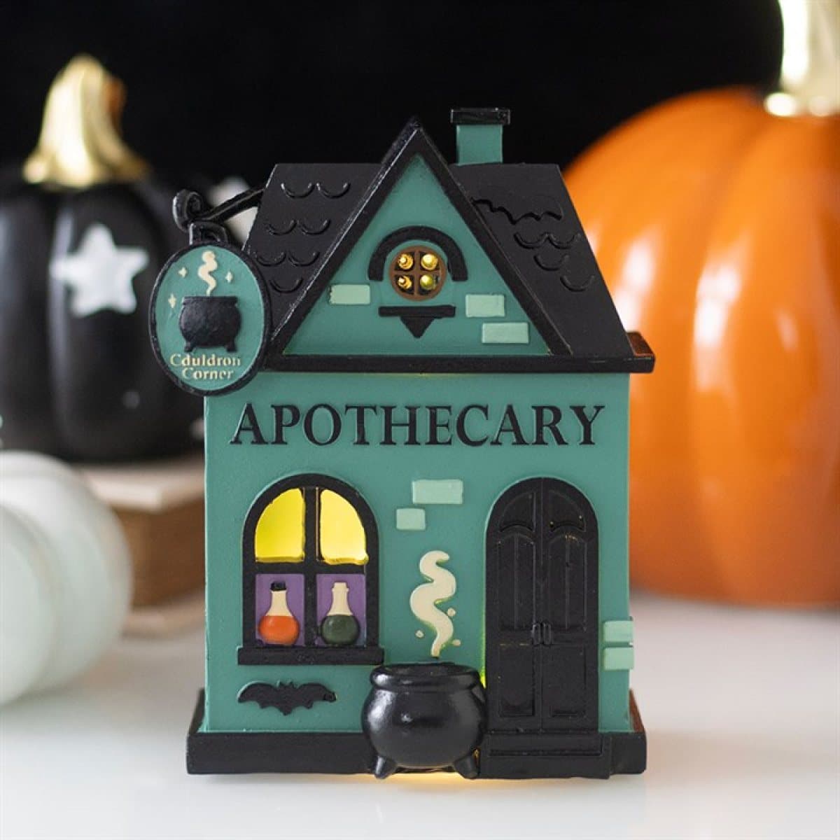 Resin apothecary shop ornament with glowing windows