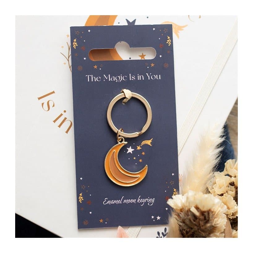Moon-themed enamel keyring on a header card