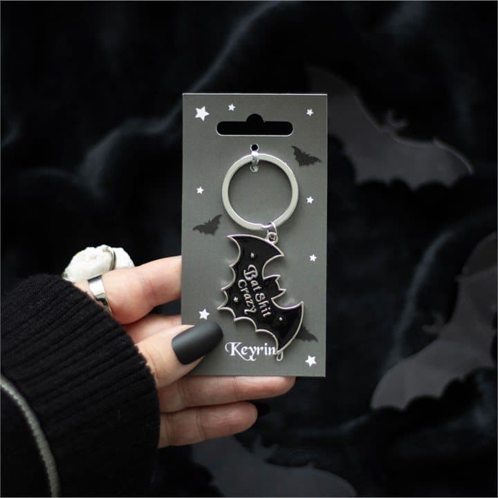 Bat-shaped alloy keyring on a colour card