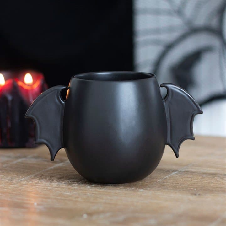 Black mug with bat wing handles