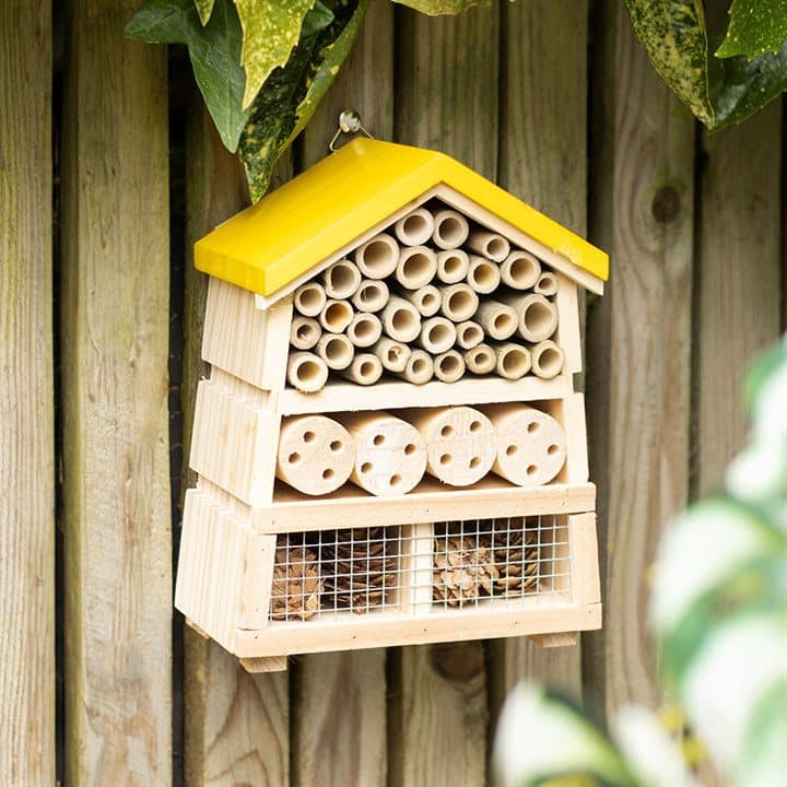 Wooden beehive shaped insect house for solitary bees