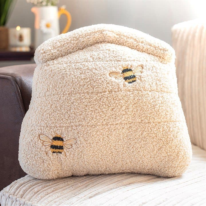 White boucle cushion shaped like a beehive