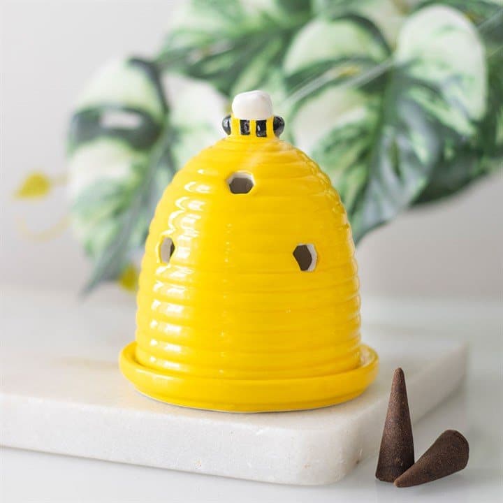 Ceramic beehive incense cone holder topped with a little bee