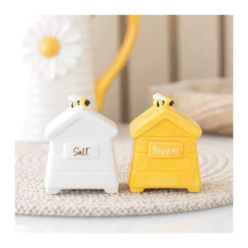 Two ceramic beehive shaped salt and pepper shakers
