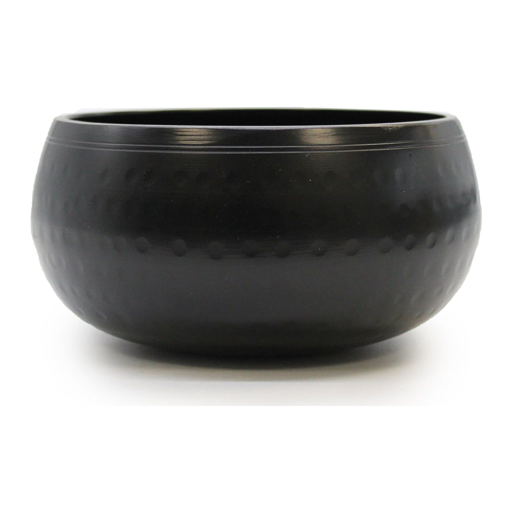 Black beaten singing bowl made from brass with a blackened finish