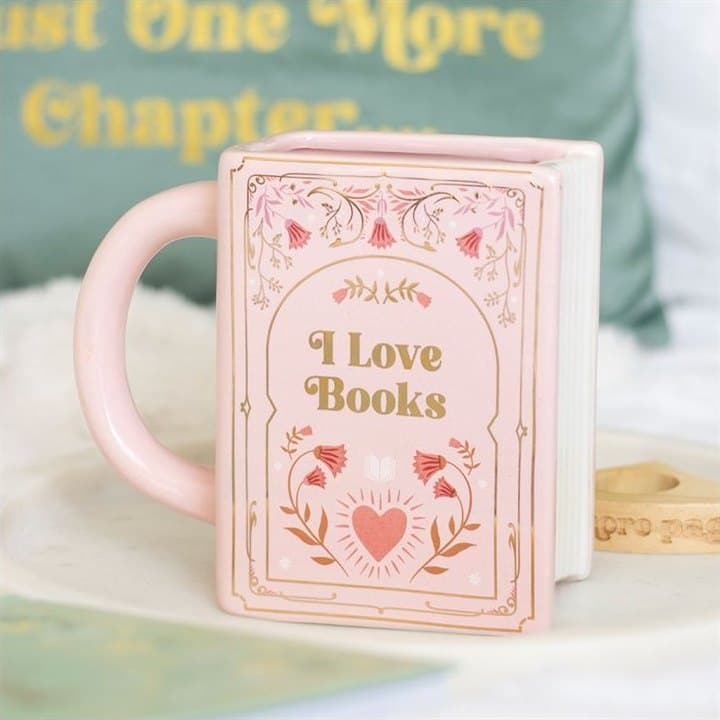 Ceramic mug shaped like a closed book with a printed cover design