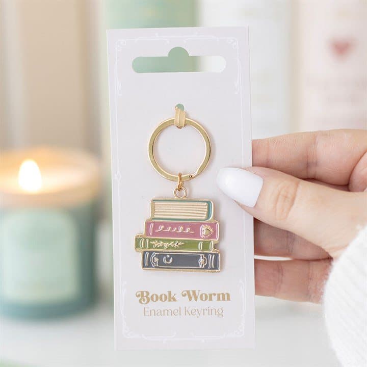 Book Worm enamel keyring on a cardboard backing card