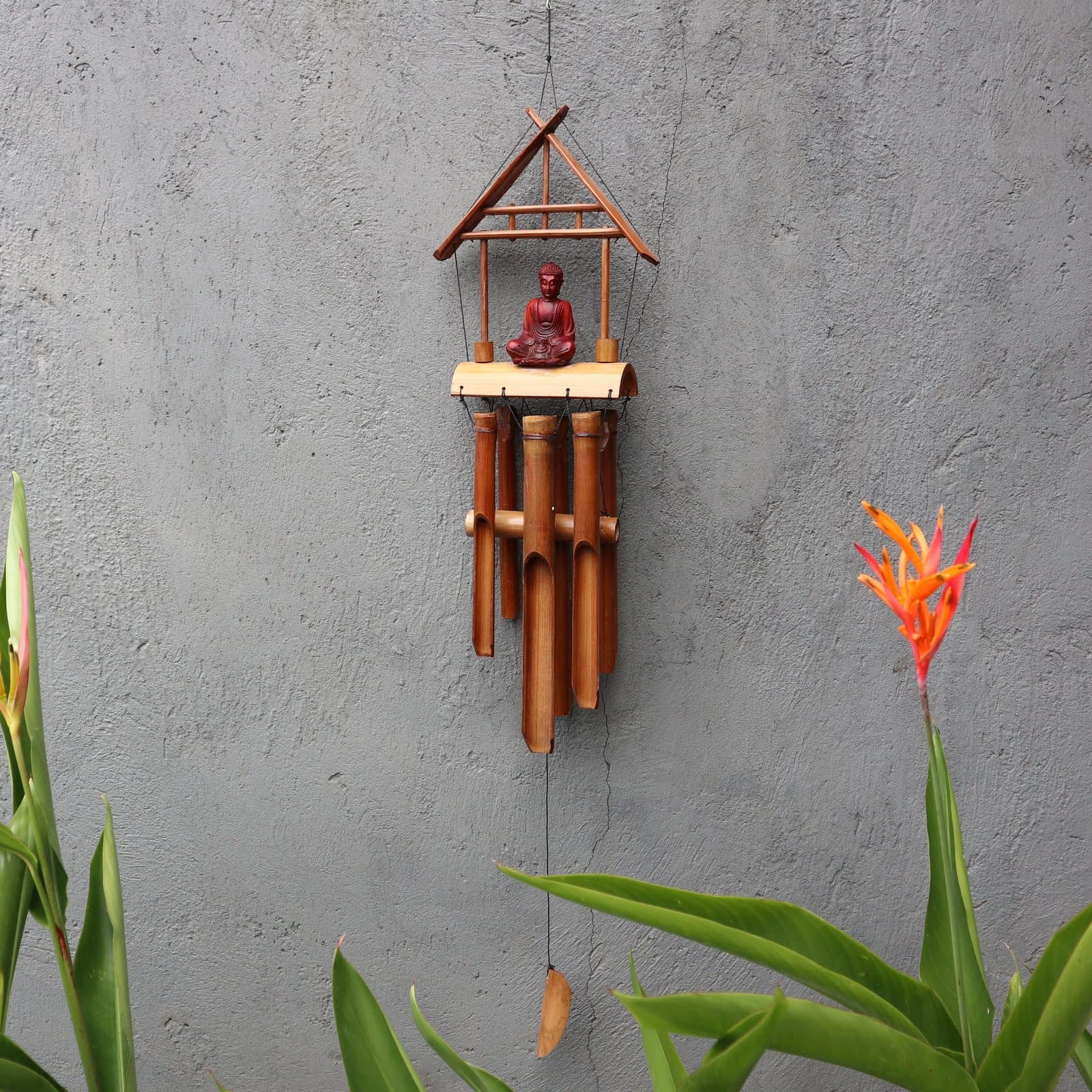 Bamboo wind chime with a carved Buddha