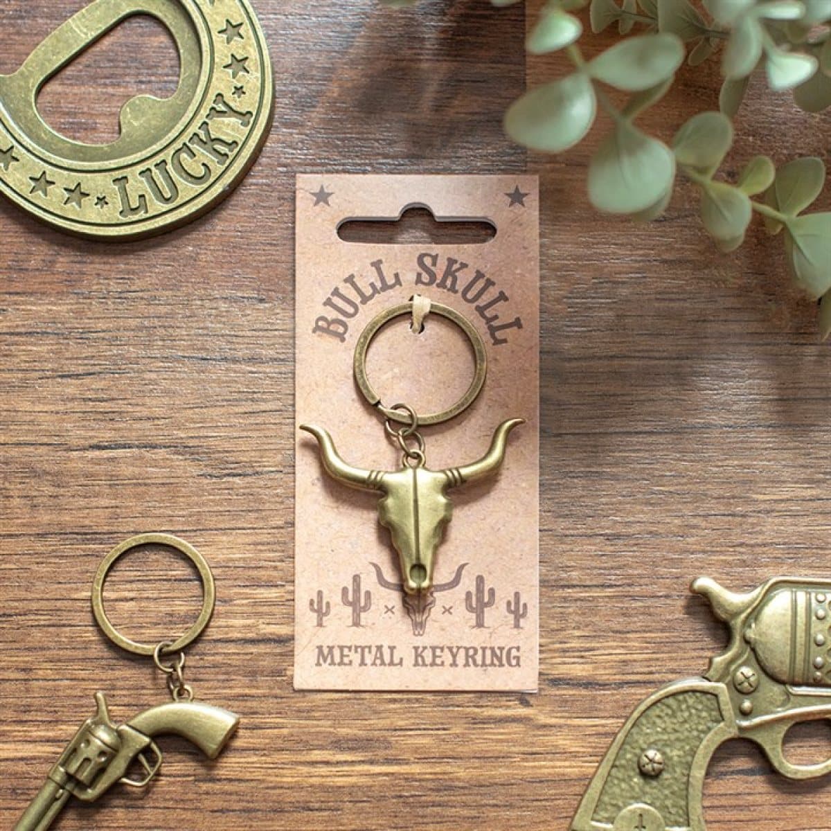 Alloy bull skull keyring with a longhorn design on a cardboard back