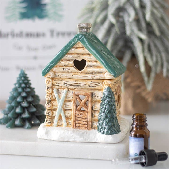 Ceramic oil burner shaped like a ski chalet