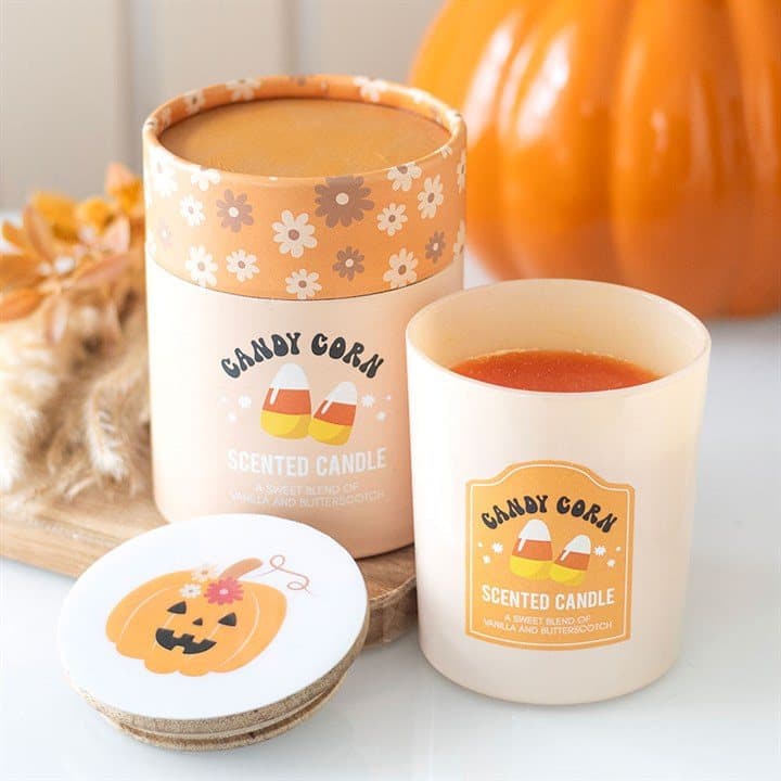 Candy corn candle with a wooden lid