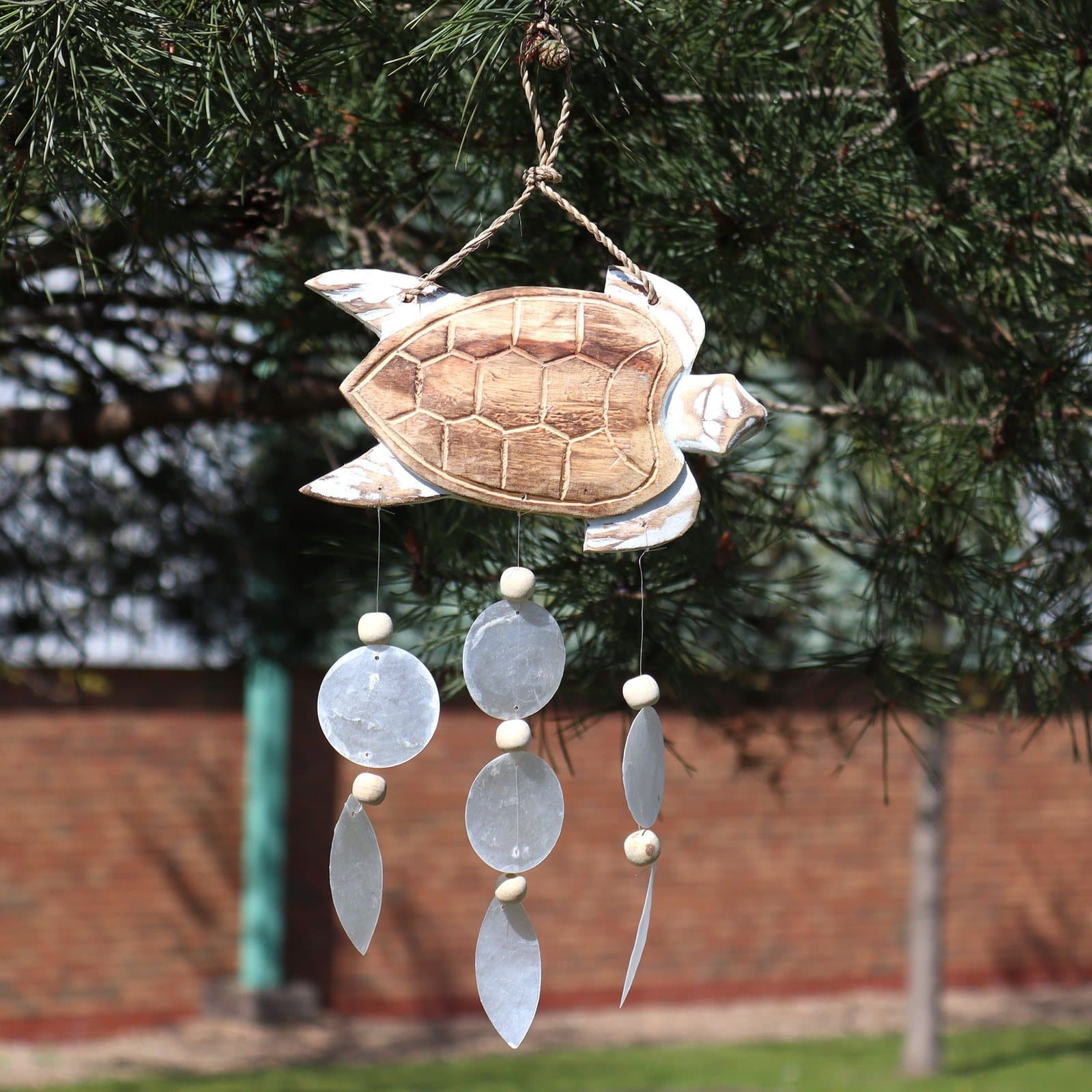 Driftwood chime with a carved fish