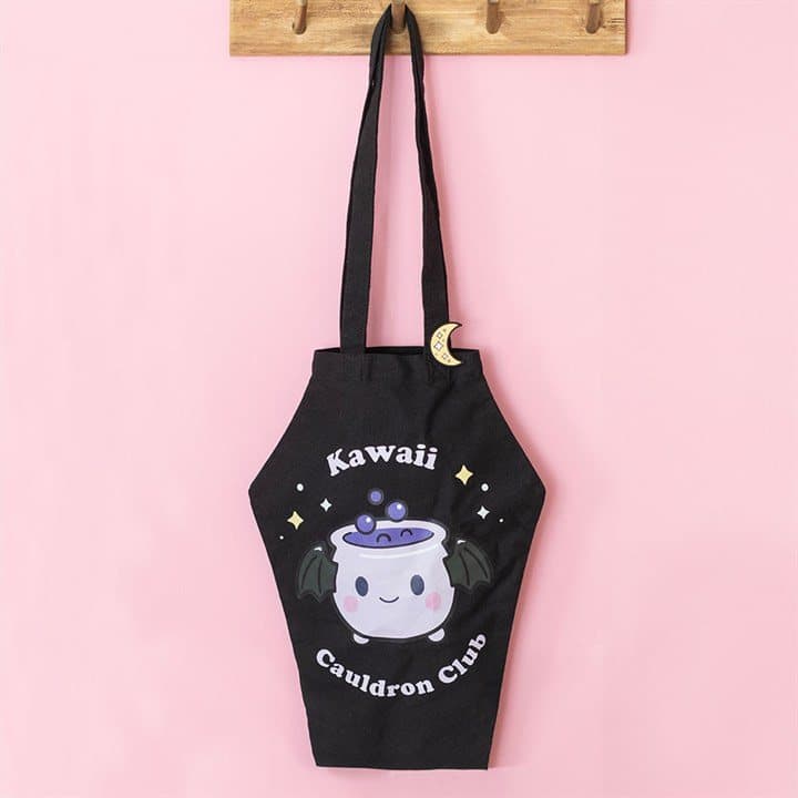 Coffin-shaped tote bag with a cauldron design