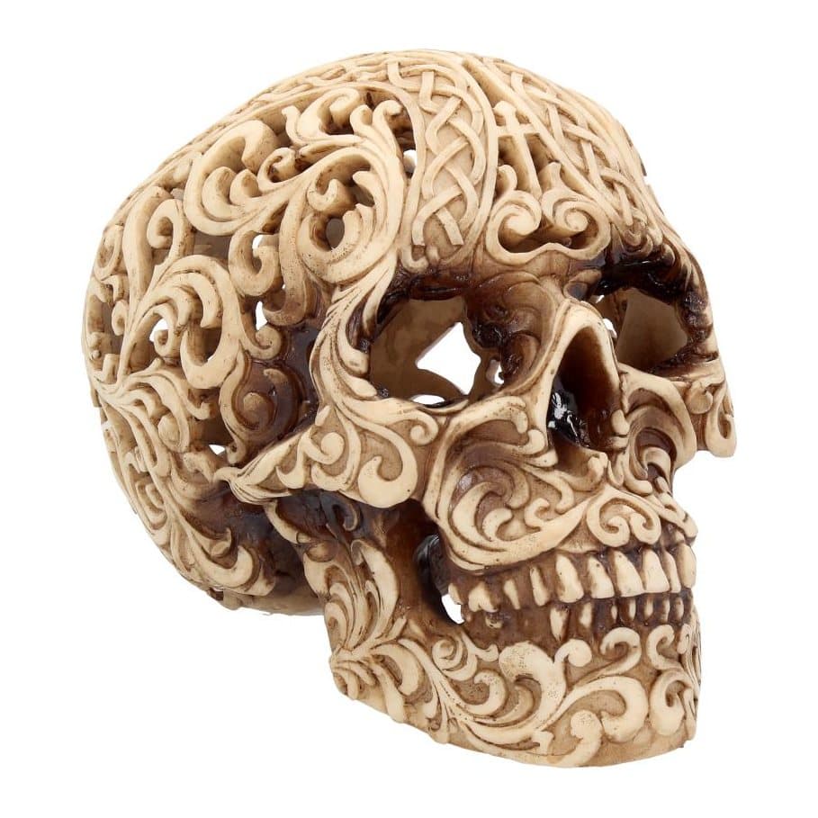 Human skull ornament carved with Baroque and Celtic patterns