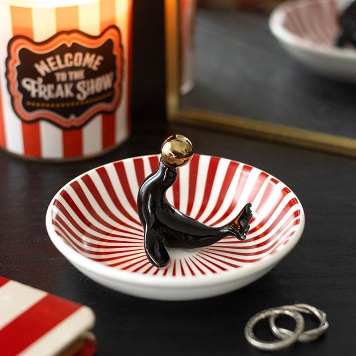 Striped trinket dish with a circus seal