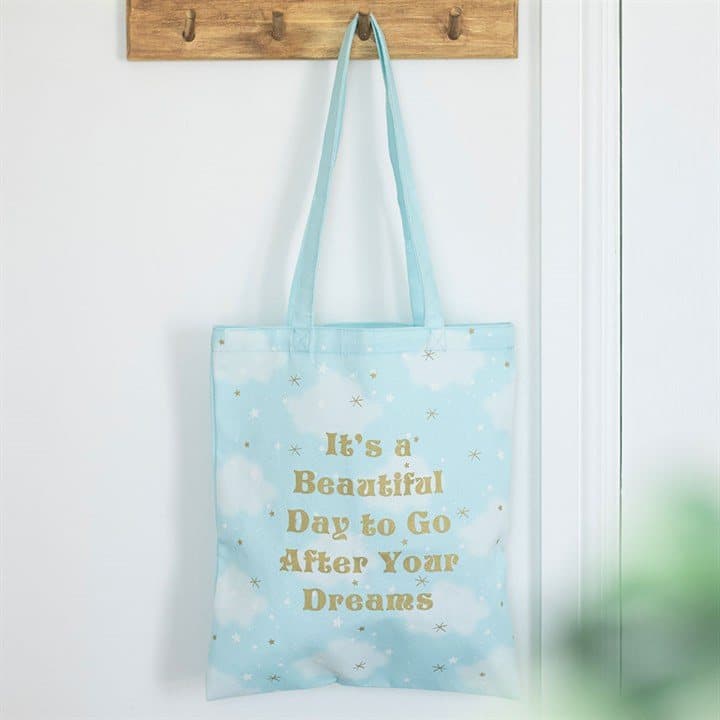 Tote bag with a soft cloud print and a positive message