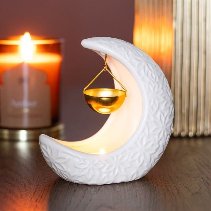 Ceramic crescent moon oil burner with a hanging gold dish