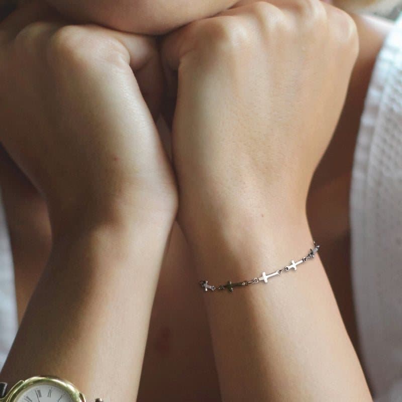 Silver cross chain bracelet with a small cross charm