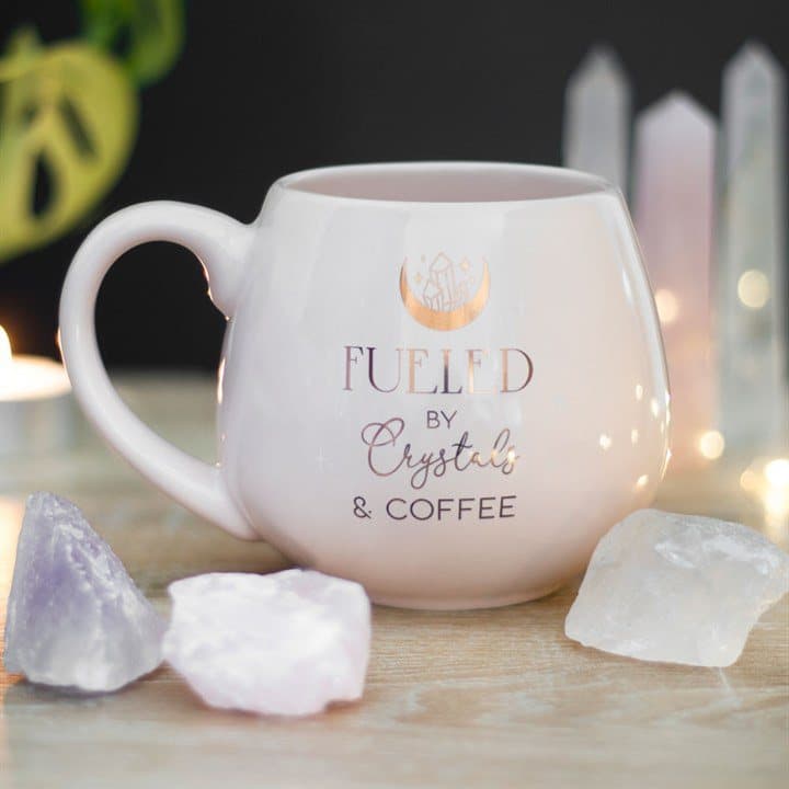 Pink rounded mug with gold foil crescent moon, crystals and coffee text