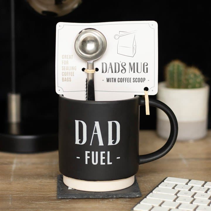 Dad Fuel mug with a coffee scoop clip beside its gift box