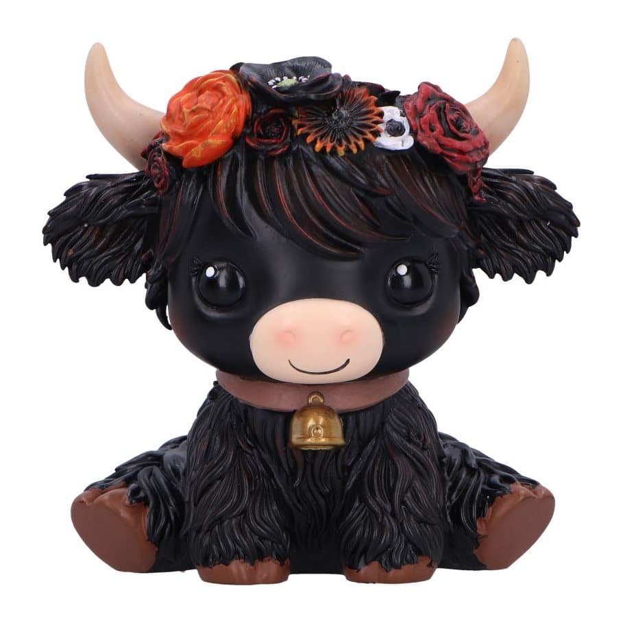 Black cow figurine seated with vibrant flowers on its head