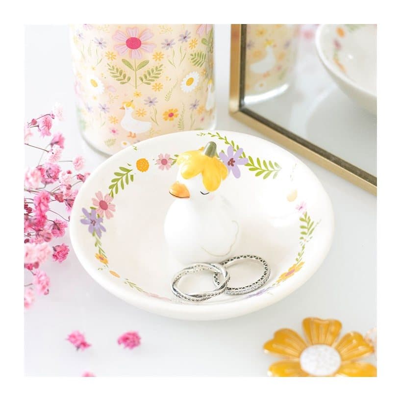 Ceramic trinket dish with a duck figure in a flower hat