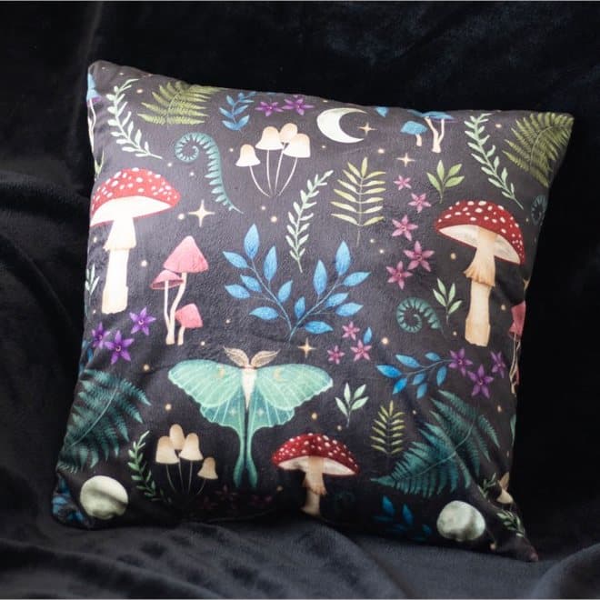 Square cushion printed with mushrooms and moths