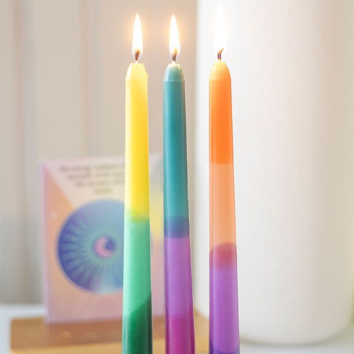 Three brightly dipped taper candles