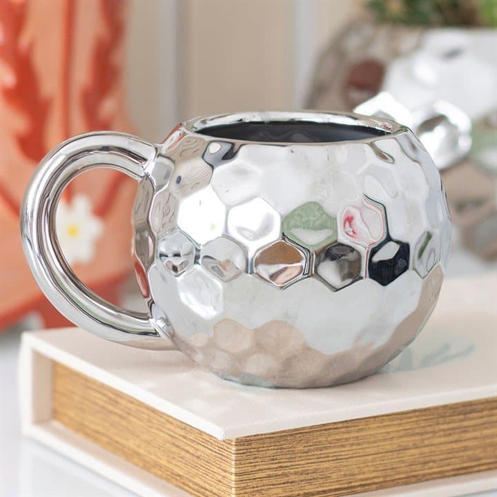 Silver ceramic mug shaped like a disco ball