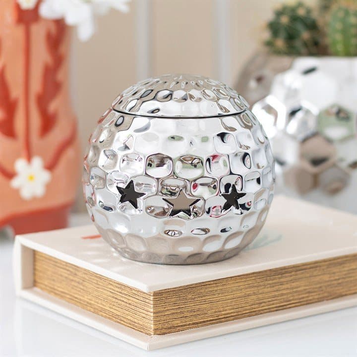 Disco ball shaped oil burner in silver and pink
