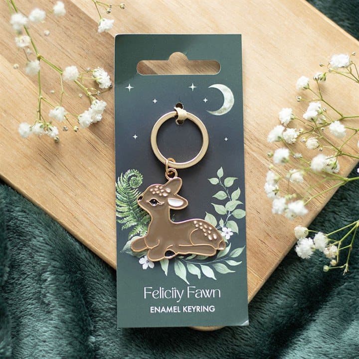 Enamel baby deer keyring on a cardboard backing card