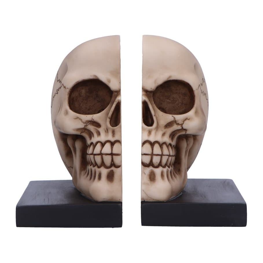 Two halves of a gothic skull set as bookends in dark aged resin