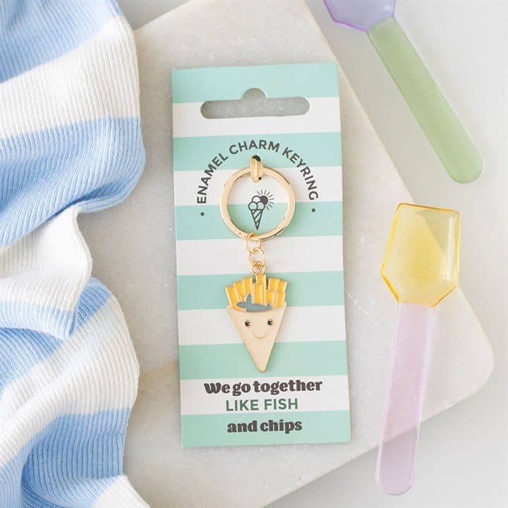 Green enamel fish and chips keyring on a cardboard backing card