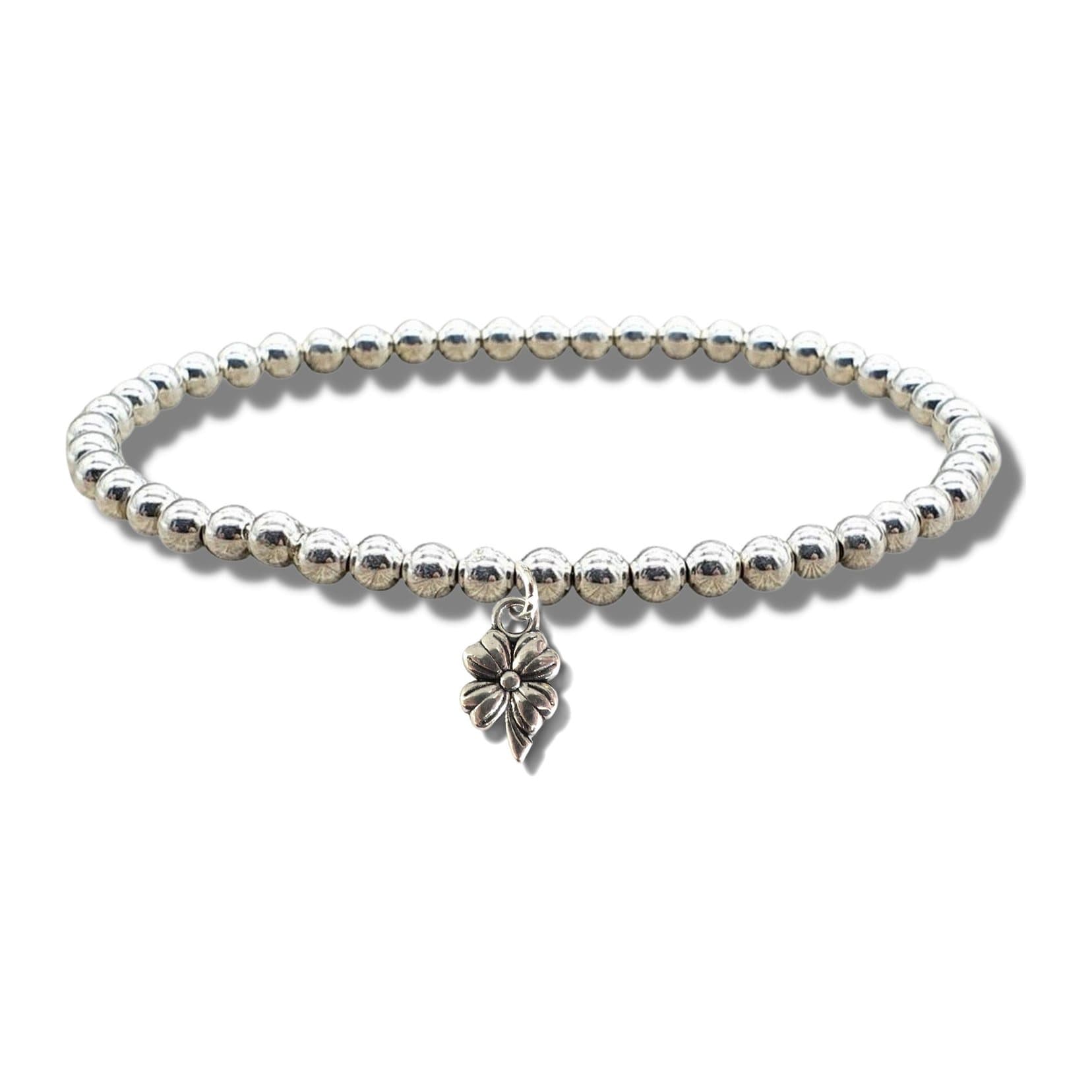 Silver beaded stretch bracelet with a silver plated flower charm