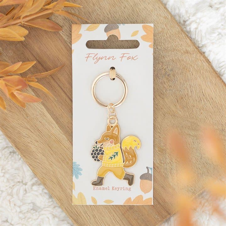 Flynn Fox enamel keyring on a cardboard backing card