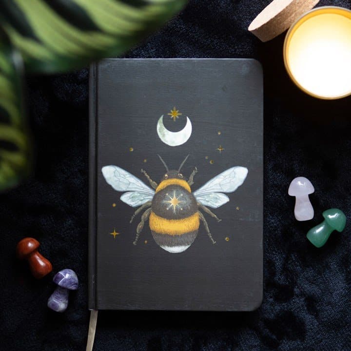 A5 notebook with a bee design and gold page edges