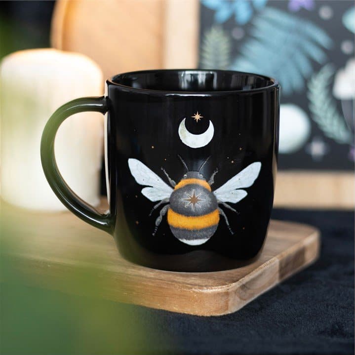 Black mug with an intricate forest bee, crescent moon and stars