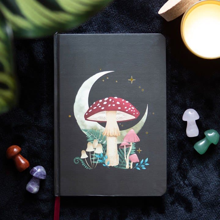 A5 notebook with a mystical mushroom design and gold foil page edges