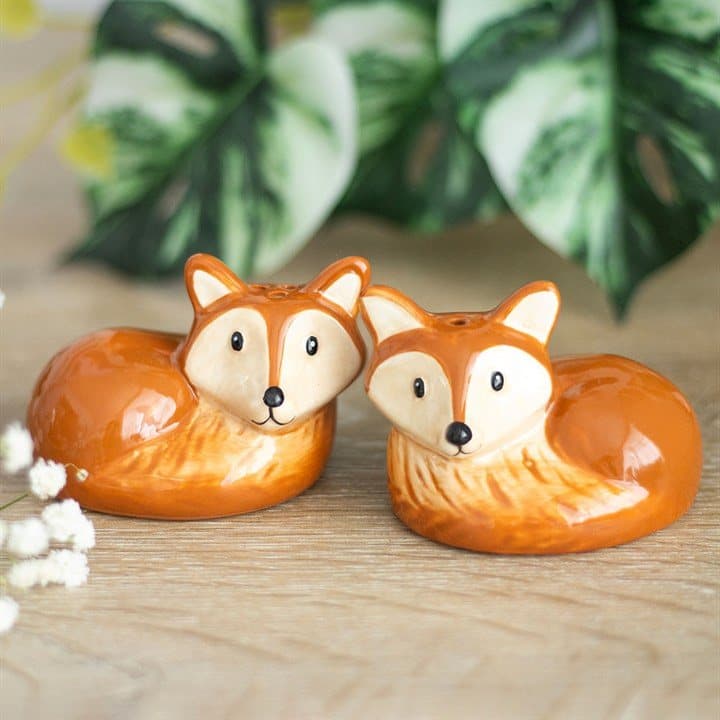 Two ceramic fox salt and pepper shakers