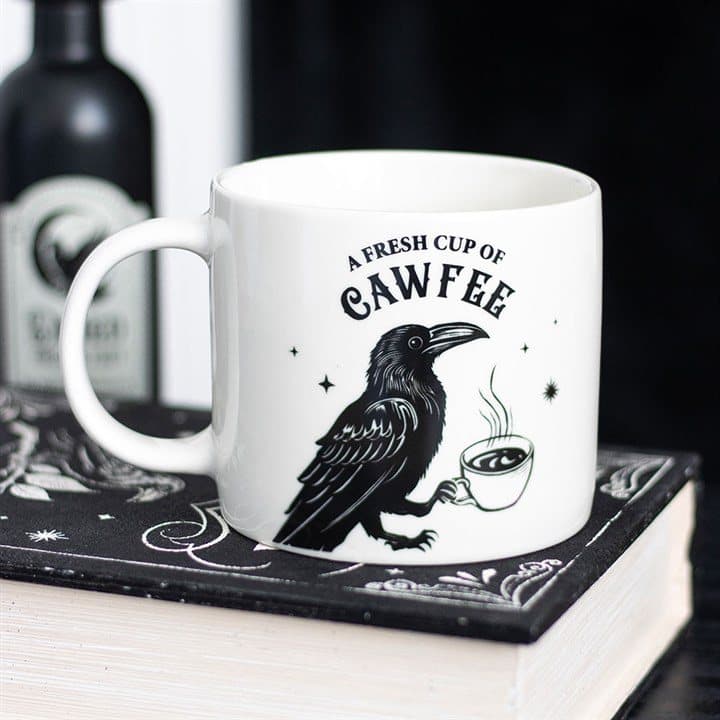 Mug with a raven holding a steaming cup of coffee