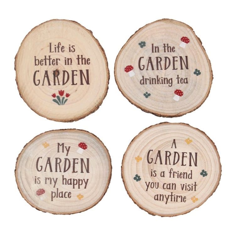 Four wooden slice coasters with garden quotes
