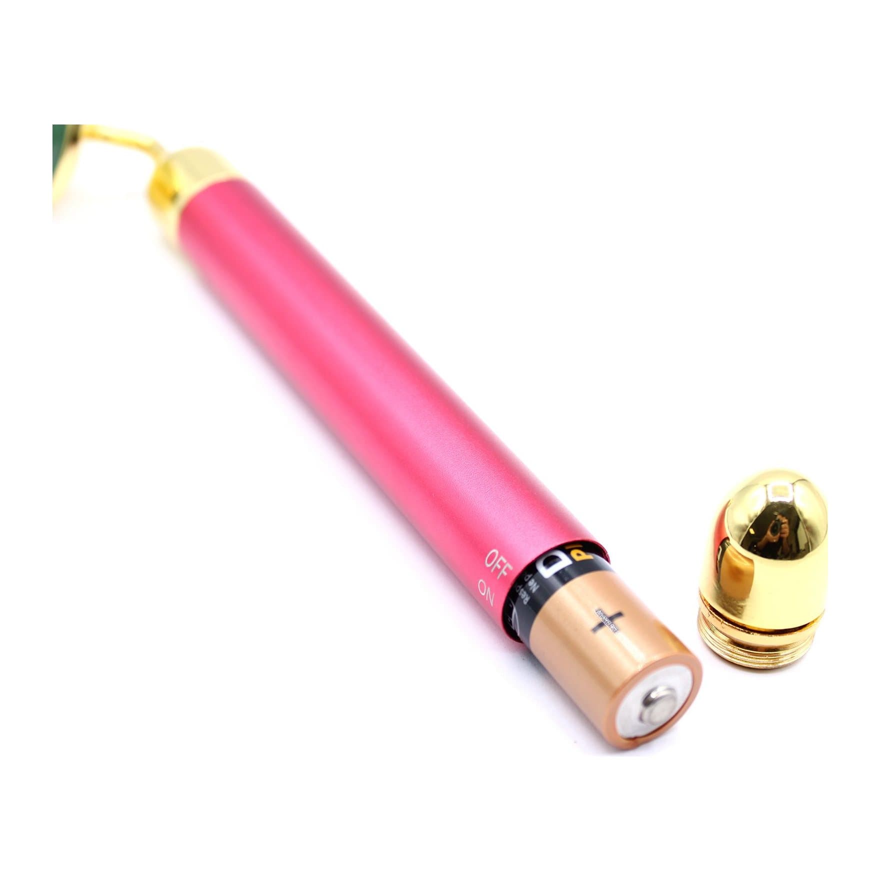 Jade gemstone vibration pad with gold-toned detailing on a slim handheld handle