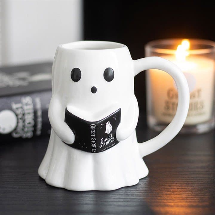 Ceramic mug with a cute ghost holding a spooky storybook