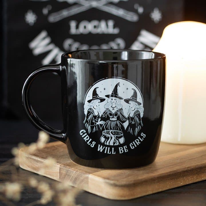 Black mug printed with three witches and Girls Will Be Girls