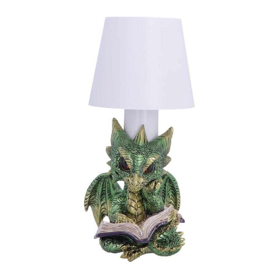 Green dragon with gold accents sitting and reading a book, forming a lamp base