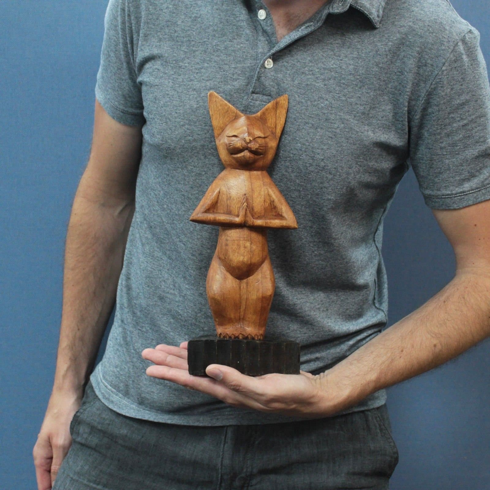 Hand-carved wooden yoga cat